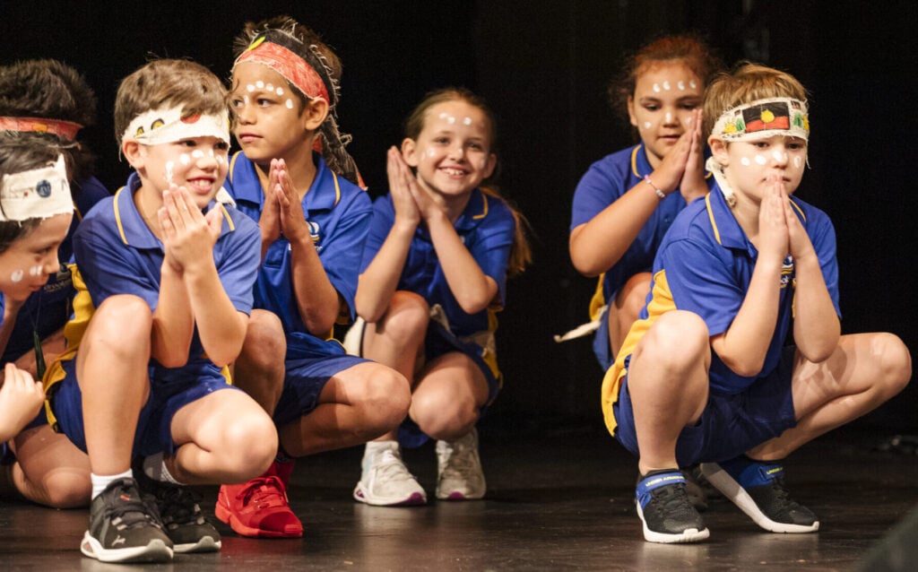 class of primary school students performing indigenous dances as part of first nations deadly arts performance