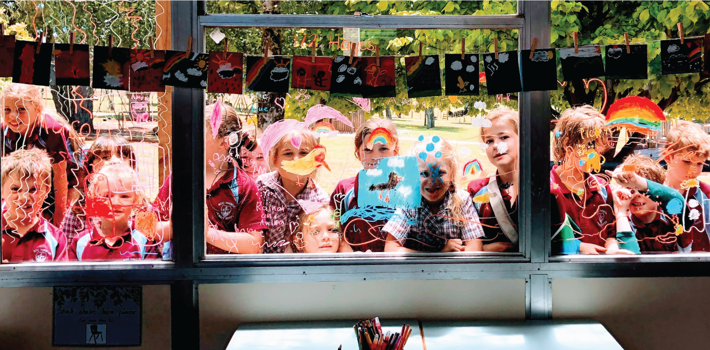 Primary School class looking through window at art they created in arts learning class