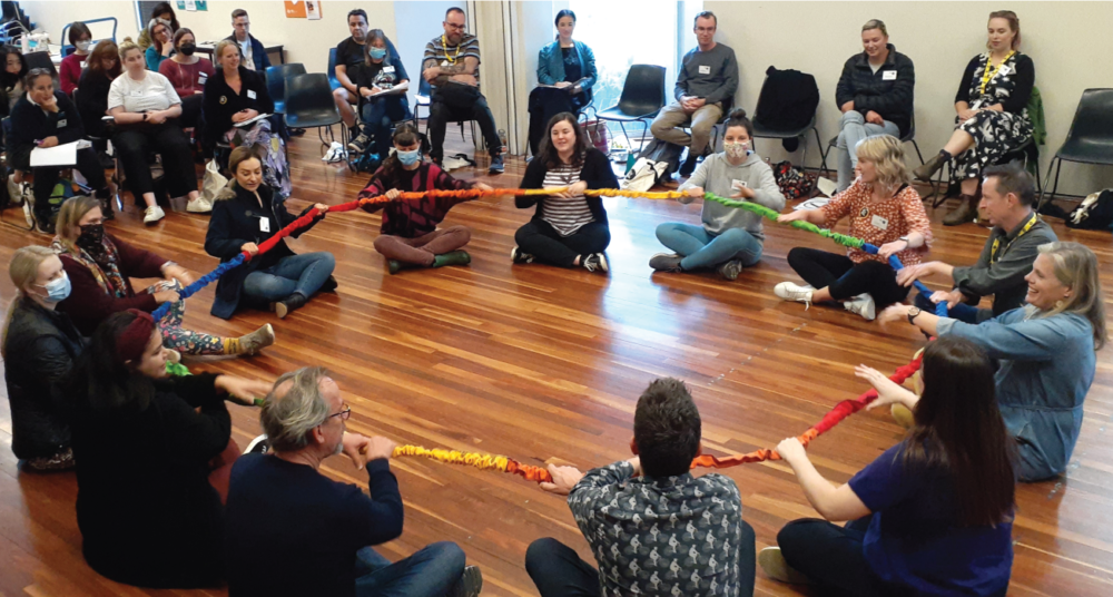 Teachers participating in an arts learning music-rope activity
