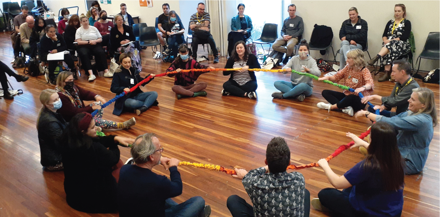 Teachers participating in an arts learning music-rope activity