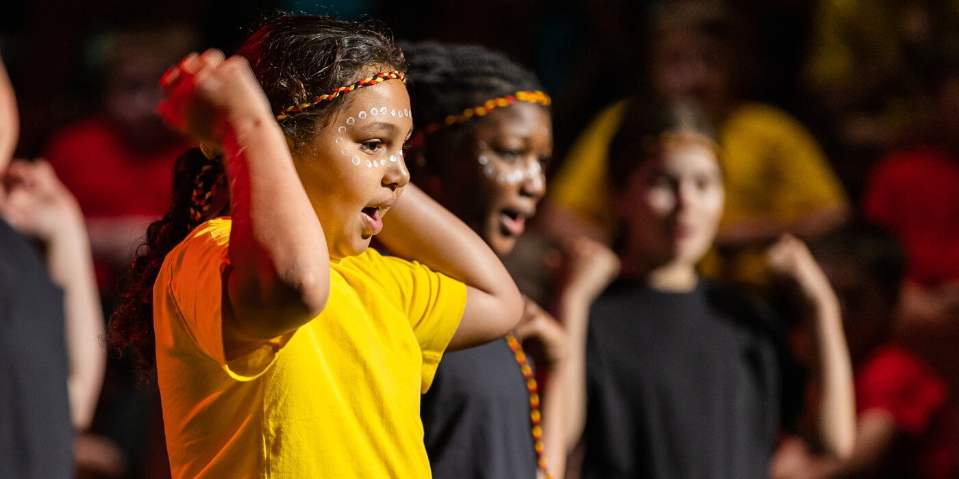 Pirmary school students perform indigenous dance at school concert