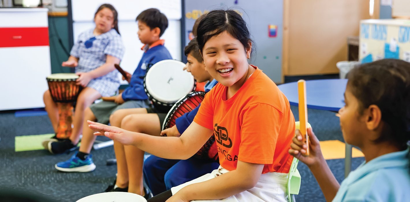 primary school students enjoying arts learning lesson with musical instruments in Western Sydney