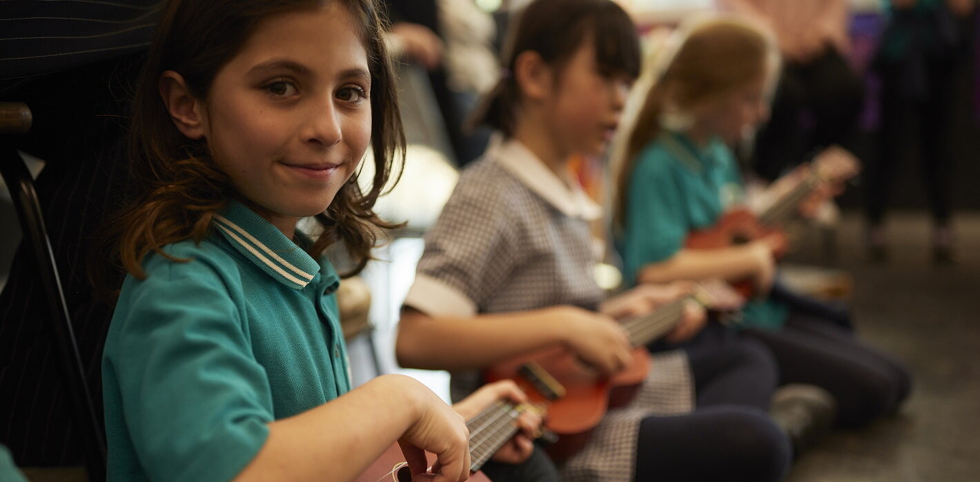primary school students in arts learning music lessons formative assessment on ukelele
