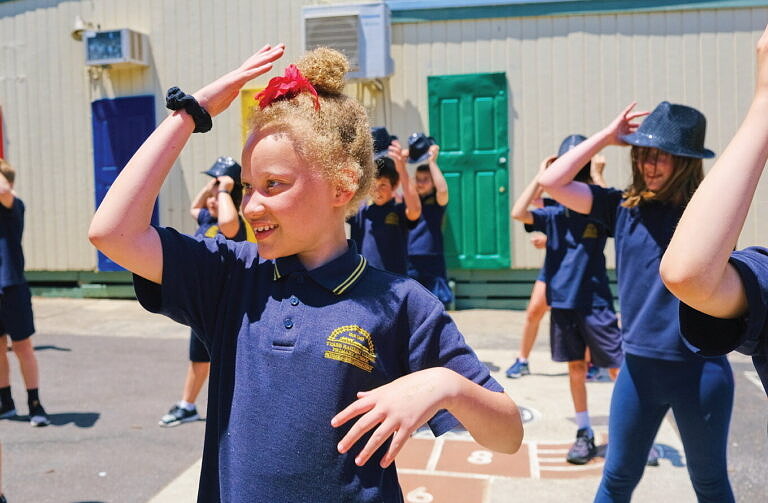 Primary school students engaged in outside dance arts and wellbeing program