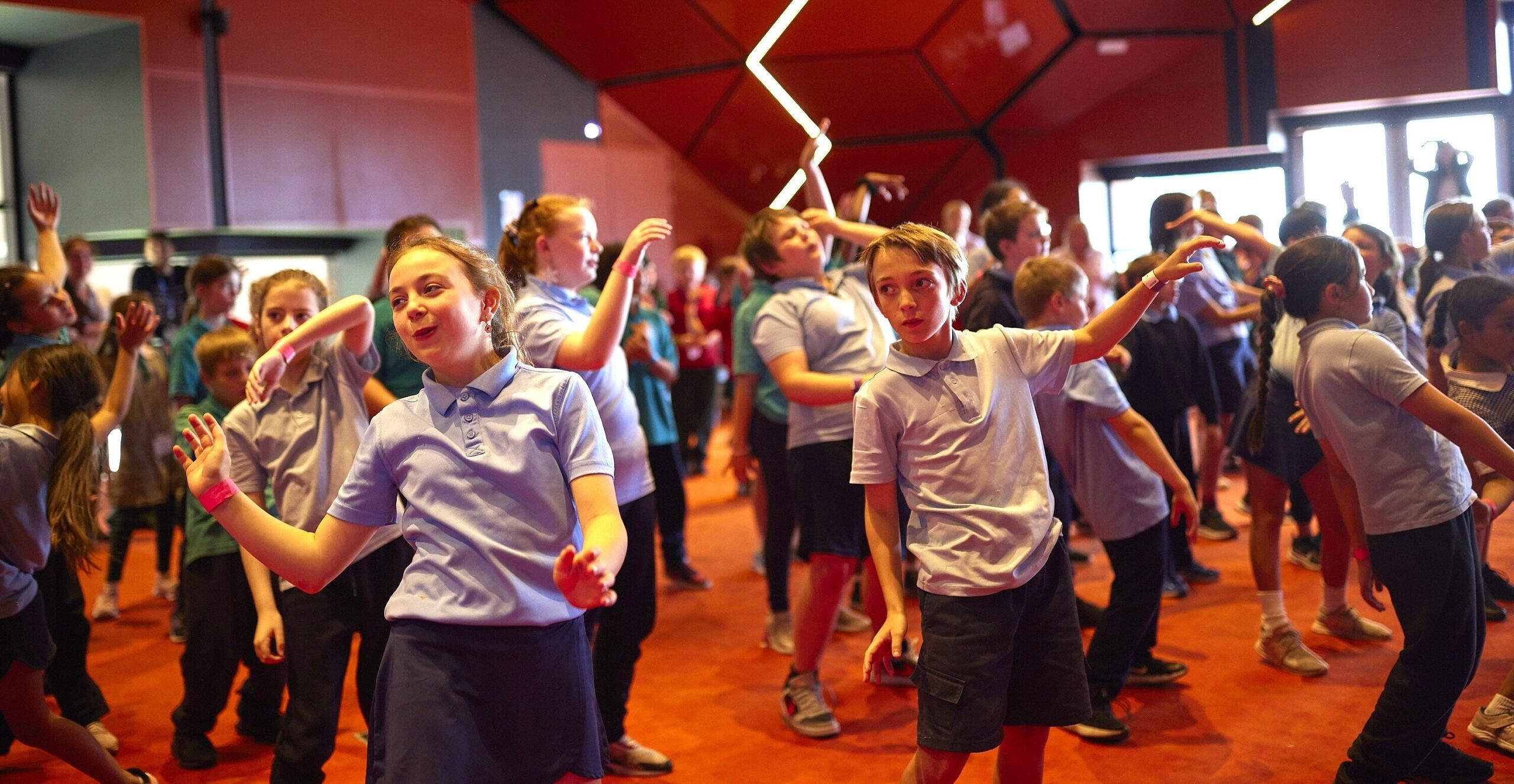 Students dancing in a arts learning workshop