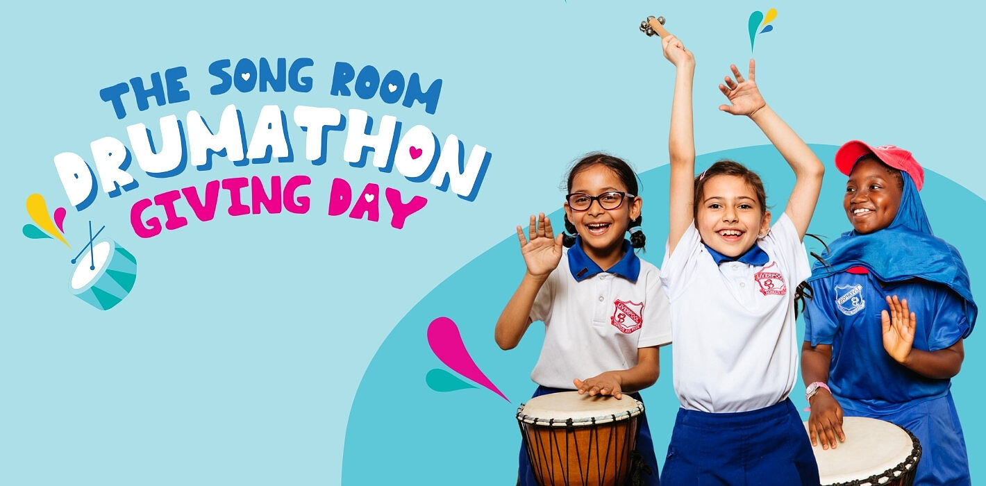Young girls drumming for The Song Room Drumathon Giving Day with link to sign up