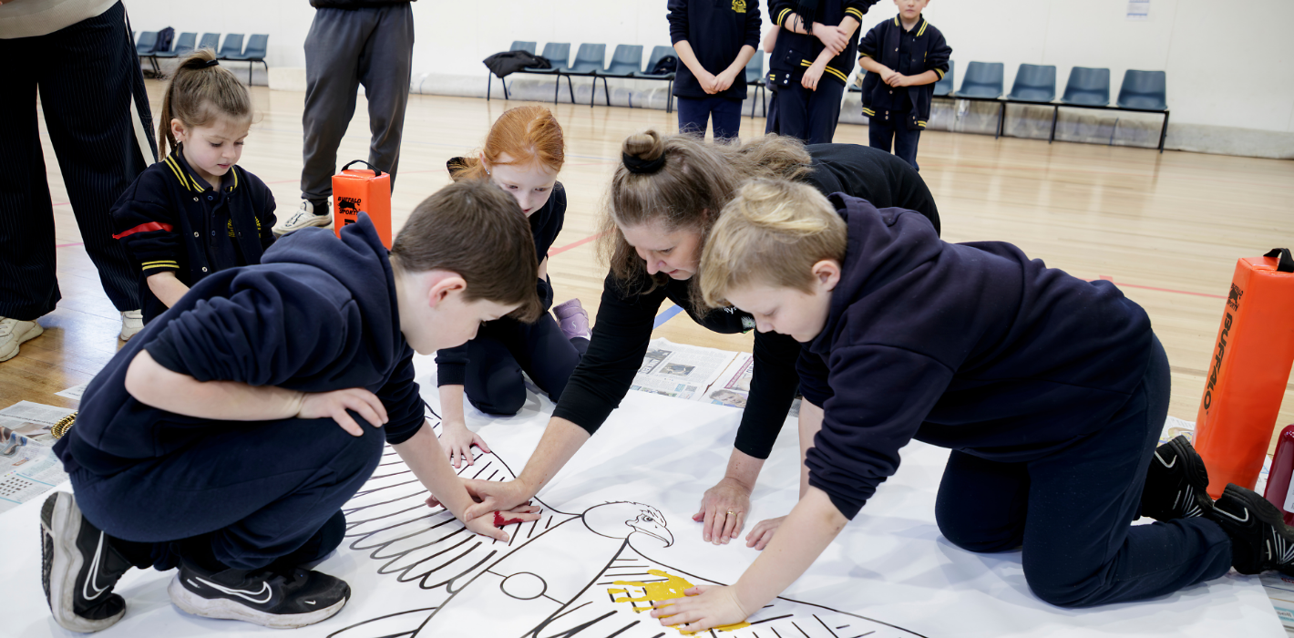 A highlight of 2025: Proud Kulin artist and Teaching Artist Aunty Sammy Trist led over 300 primary students from Tyabb Railway Station, Crib Point, and Red Hill Consolidated schools in Victoria on a powerful journey of cultural learning through The Song Room’s Deadly Arts program.