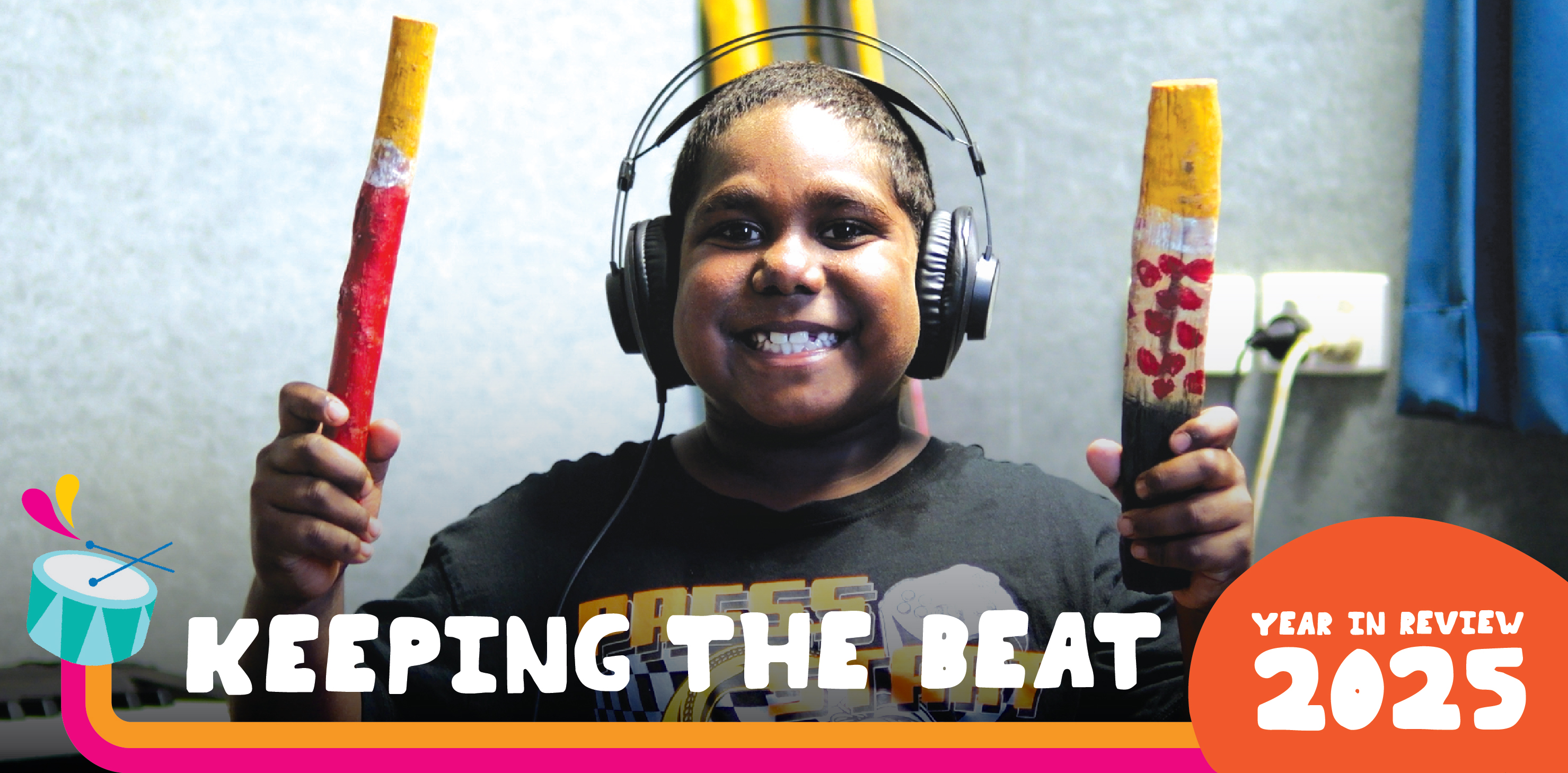 Cover of 2025 Year in Review showing smiling boy playing instruments