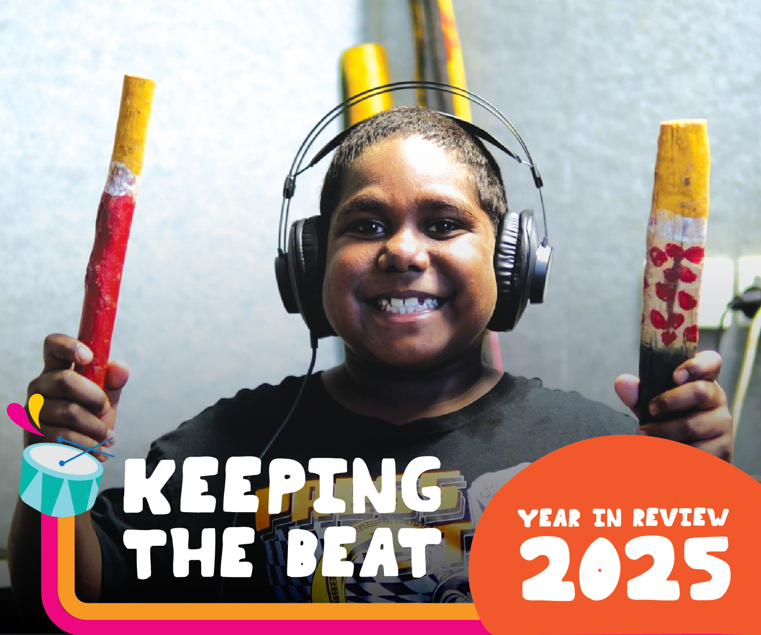 Cover of 2025 Year in Review showing smiling boy playing instruments